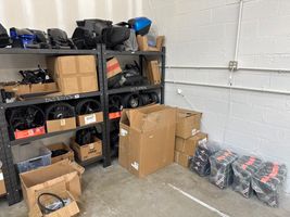  LOT OF BRAKE CABLES, BRAKE PADS, RIMS, BODY PANELS, TIRES, EXHAUST, AND SCOOTER COVERS  